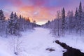 Sunrise over a river in winter near Levi, Finnish Lapland Royalty Free Stock Photo
