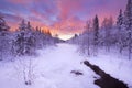 Sunrise over a river in winter near Levi, Finnish Lapland Royalty Free Stock Photo