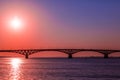 Sunrise over a road bridge across the Volga river between the cities of Saratov and Engels, Russia Royalty Free Stock Photo