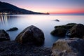 Sunrise over rocky black sea coastline Royalty Free Stock Photo