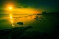 Sunrise over the rocky sea shore Royalty Free Stock Photo