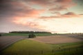 Sunrise over rolling hills and fields in the english countryside Royalty Free Stock Photo