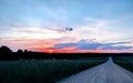 Sunrise Over a Rural Gravel Road