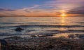 Sunrise over the sea and beautiful cloudscape. Colorful ocean beach sunrise with deep blue sky and sunrays Sunset, beach Royalty Free Stock Photo