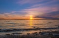 Sunrise over the sea and beautiful cloudscape. Colorful ocean beach sunrise with deep blue sky and sunrays Sunset, beach Royalty Free Stock Photo