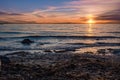 Sunrise over the sea and beautiful cloudscape. Colorful ocean beach sunrise with deep blue sky and sunrays Sunset, beach Royalty Free Stock Photo