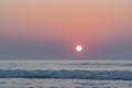 Sunrise over the sea with a close angle to the summer rising sun Royalty Free Stock Photo