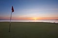 Sunrise over the sea from a golf green Royalty Free Stock Photo