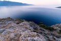 Sunrise over sea and mountains. Rocks and water senery Royalty Free Stock Photo