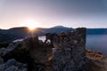 Sunrise over sea and mountains. Rocks and water senery Royalty Free Stock Photo