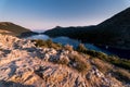 Sunrise over sea and mountains. Rocks and water senery Royalty Free Stock Photo