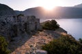 Sunrise over sea and mountains. Rocks and water senery Royalty Free Stock Photo