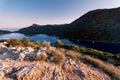 Sunrise over sea and mountains. Rocks and water senery Royalty Free Stock Photo