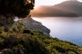 Sunrise over sea and mountains. Rocks and water senery Royalty Free Stock Photo