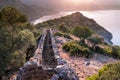 Sunrise over sea and mountains. Rocks and water senery Royalty Free Stock Photo