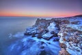 Sunrise over the sea and rocky shore Royalty Free Stock Photo