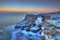 Sunrise over the sea and rocky shore Royalty Free Stock Photo