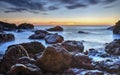 Sunrise over the sea and rocky shore Royalty Free Stock Photo