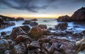 Sunrise over the sea and rocky shore Royalty Free Stock Photo