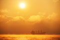 Sunrise over the sea with sailing cargo ship,. Transportation. L Royalty Free Stock Photo