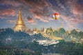 Sunrise over Shwedagon Pagoda in Yangon in Myanmar and a balloon