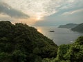 Sunrise over small offshore island on rugged Sea of Japan coast