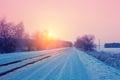 Sunrise over snowy road Royalty Free Stock Photo