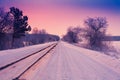 Sunrise over snowy road Royalty Free Stock Photo