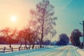 Sunrise over snowy road Royalty Free Stock Photo