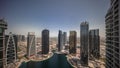 Sunrise over tall residential buildings at JLT aerial all day timelapse