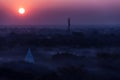 Sunrise over temples of misty and foggy Bagan in Royalty Free Stock Photo