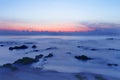 Sunrise over the tropical seacoast beach. The wave of seawater u