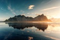 Sunrise over Vestrahorn mountain with reflection on black sand beach in summer at Iceland