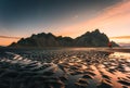 Sunrise over Vestrahorn mountain with rippled black sand beach in summer on Stokksnes peninsula at Iceland Royalty Free Stock Photo