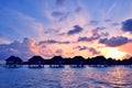 Sunrise over water bungalows in Maldives Royalty Free Stock Photo