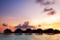 Sunrise over water bungalows in Maldives Royalty Free Stock Photo