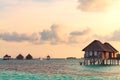 Sunrise over water bungalows in Maldives Royalty Free Stock Photo