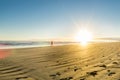 Sunrise over wide flat sandy beach at Ohope Whakatane