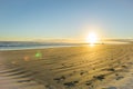 Sunrise over wide flat sandy beach at Ohope Whakatane