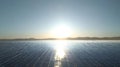 Sunrise Over a Wide Solar Panel Field ai generated Royalty Free Stock Photo