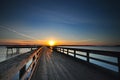 Sunrise over a wooden pier