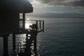 Sunrise on a overwater bungalow. Moorea, French Polynesia Royalty Free Stock Photo