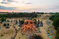 Sunrise at the ozorian valley while people dancing at the main stage. Royalty Free Stock Photo