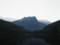 Sunrise panorama mirror reflection view of alpine forest mountain lake Piburger See Oetztal Alps Tyrol Austria Europe Royalty Free Stock Photo