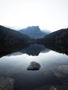 Sunrise panorama mirror reflection view of alpine forest mountain lake Piburger See Oetztal Alps Tyrol Austria Europe Royalty Free Stock Photo