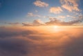 Sunrise panorama in orange and yellow colors. Sky background. View from an airplane during a vacation flight