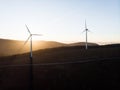 Sunrise panorama of wind turbines farm park on mountain hill top at Baloico do Trevim Lousa swing Coimbra Portugal