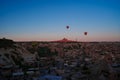 Sunrise panoramic view to Goreme city and flying balloons, Cappadocia, Turkey Royalty Free Stock Photo