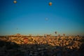 Sunrise panoramic view to Goreme city and flying balloons, Cappadocia, Turkey Royalty Free Stock Photo