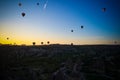 Sunrise panoramic view to Goreme city and flying balloons, Cappadocia, Turkey